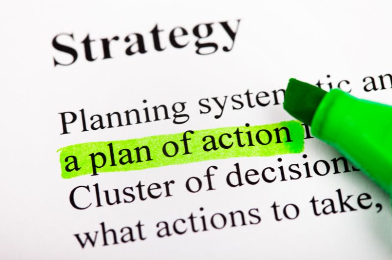 Definition-of-strategy-in-background-with-some-words-highlighted-in-green